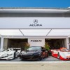 The new Acura NSX (center) is flanked by a pair of champions: the 2009 ALMS Champion Acura ARX-02a (left) and 1991-1993 IMSA Champion Spice Acura (right)
